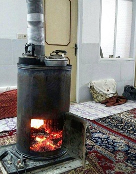 تصویری از بخاری چوبی در روستاهای کردستان